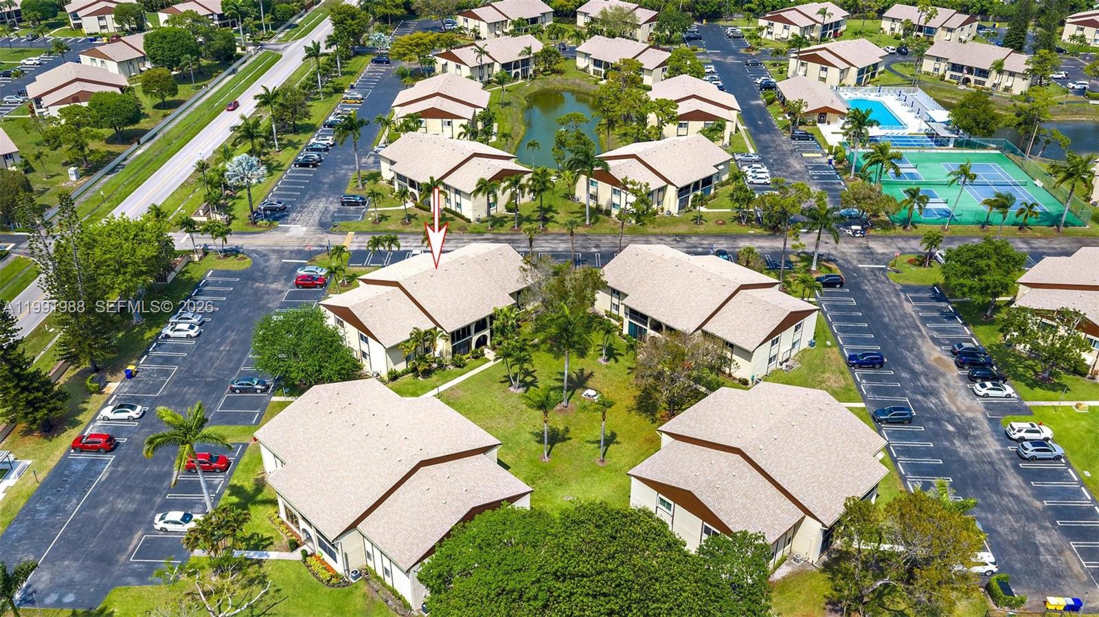 301 Pine Ridge Circle, Unit C1 Greenacres, FL 33463 - Photo 2 of 30 an aerial view of residential house with outdoor space and street view