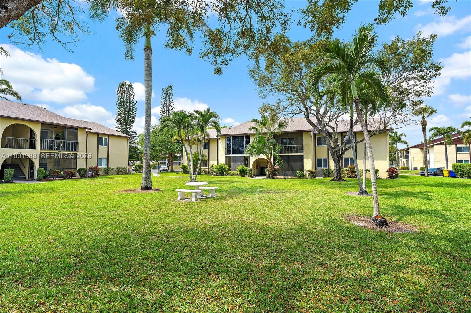 301 Pine Ridge Circle, Unit C1 Greenacres, FL 33463 - Photo 22 of 30 a view of a house with a backyard