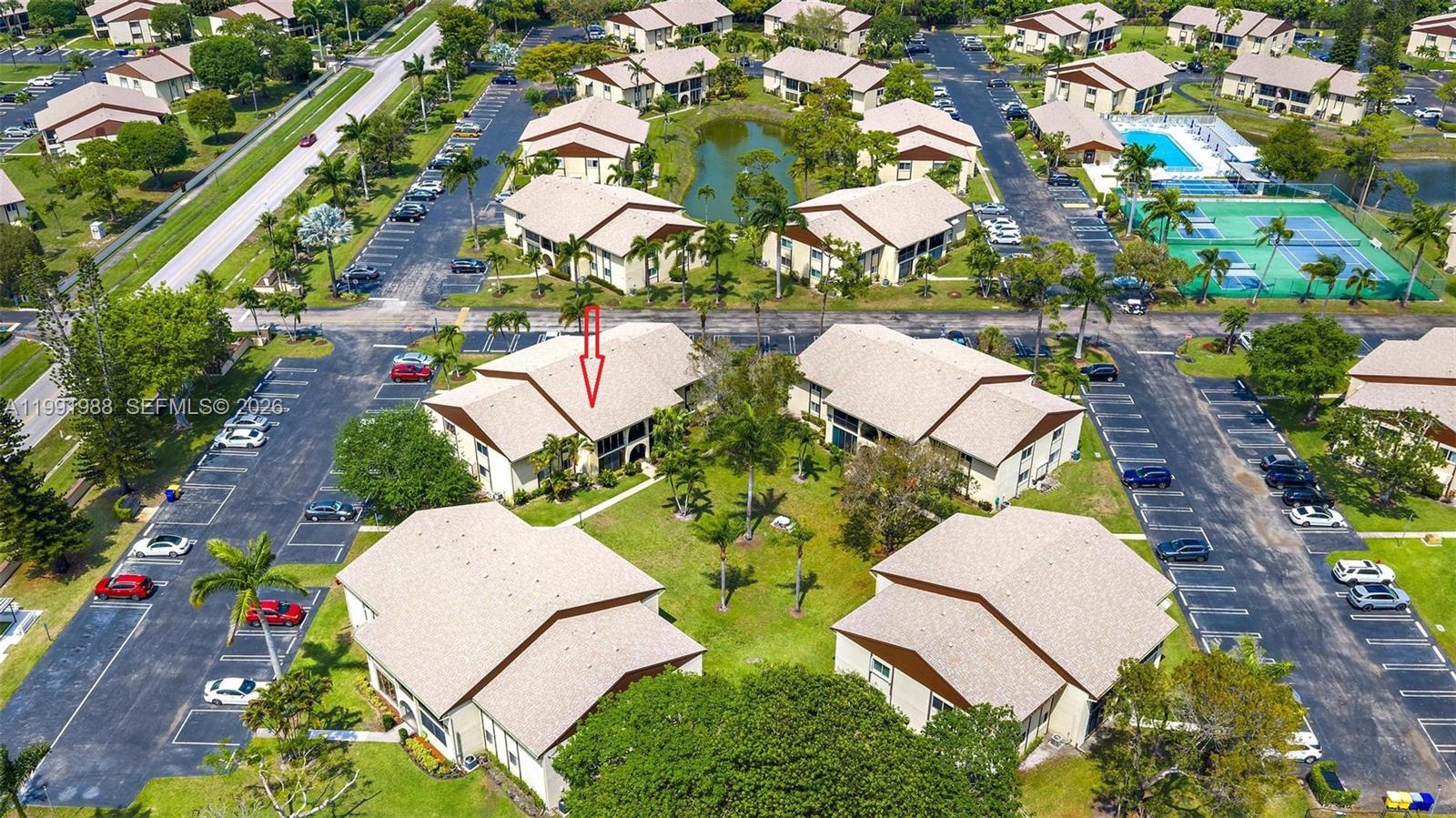 301 Pine Ridge Circle, Unit C1 Greenacres, FL 33463 - Photo 29 of 30 an aerial view of a house with swimming pool and outdoor space