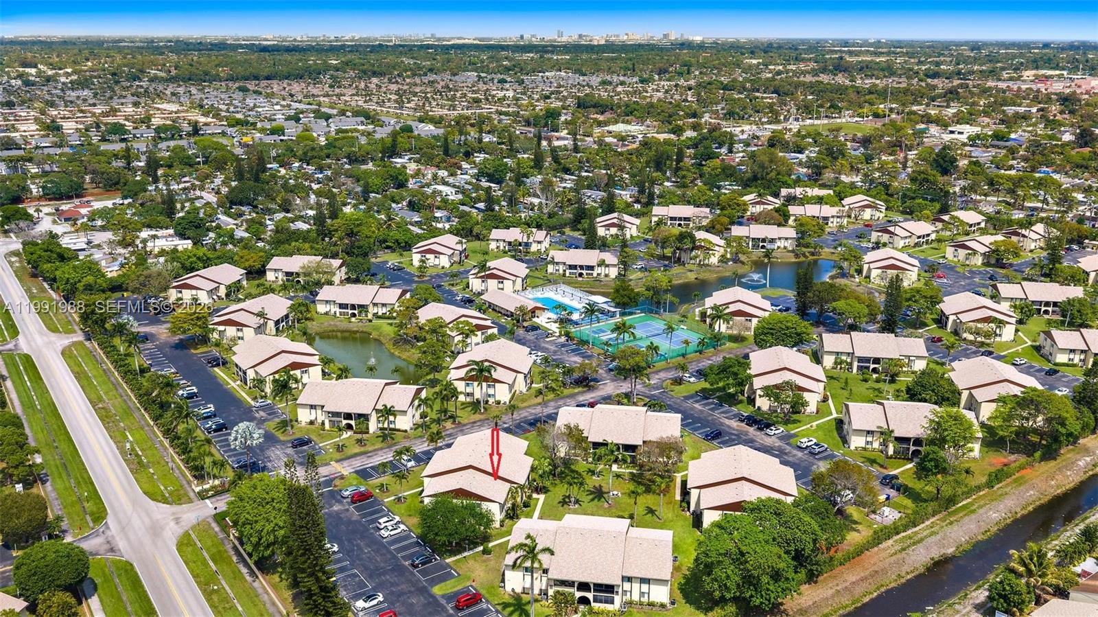 301 Pine Ridge Circle, Unit C1 Greenacres, FL 33463 - Photo 30 of 30 an aerial view of residential houses with outdoor space