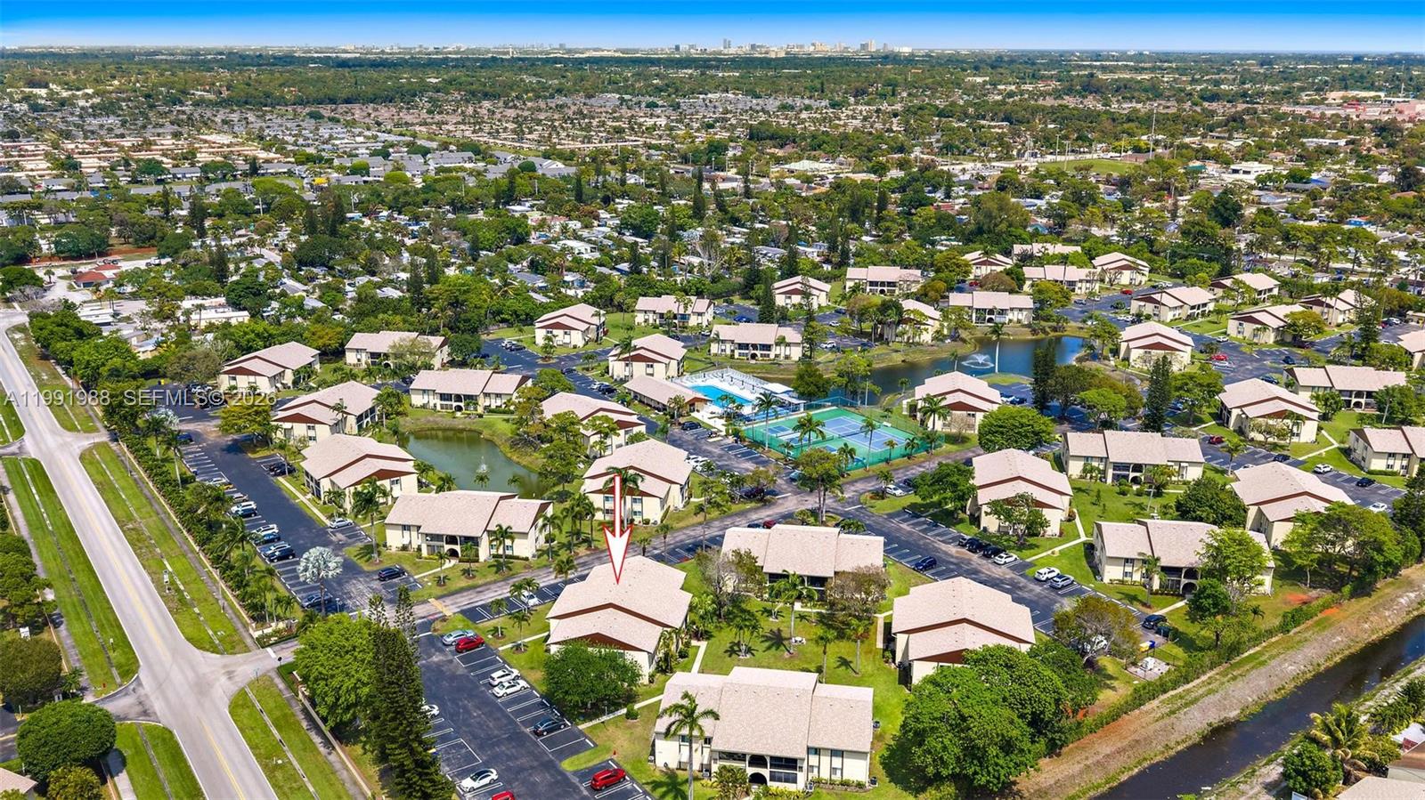 301 Pine Ridge Circle, Unit C1 Greenacres, FL 33463 - Photo 3 of 30 an aerial view of residential houses with outdoor space