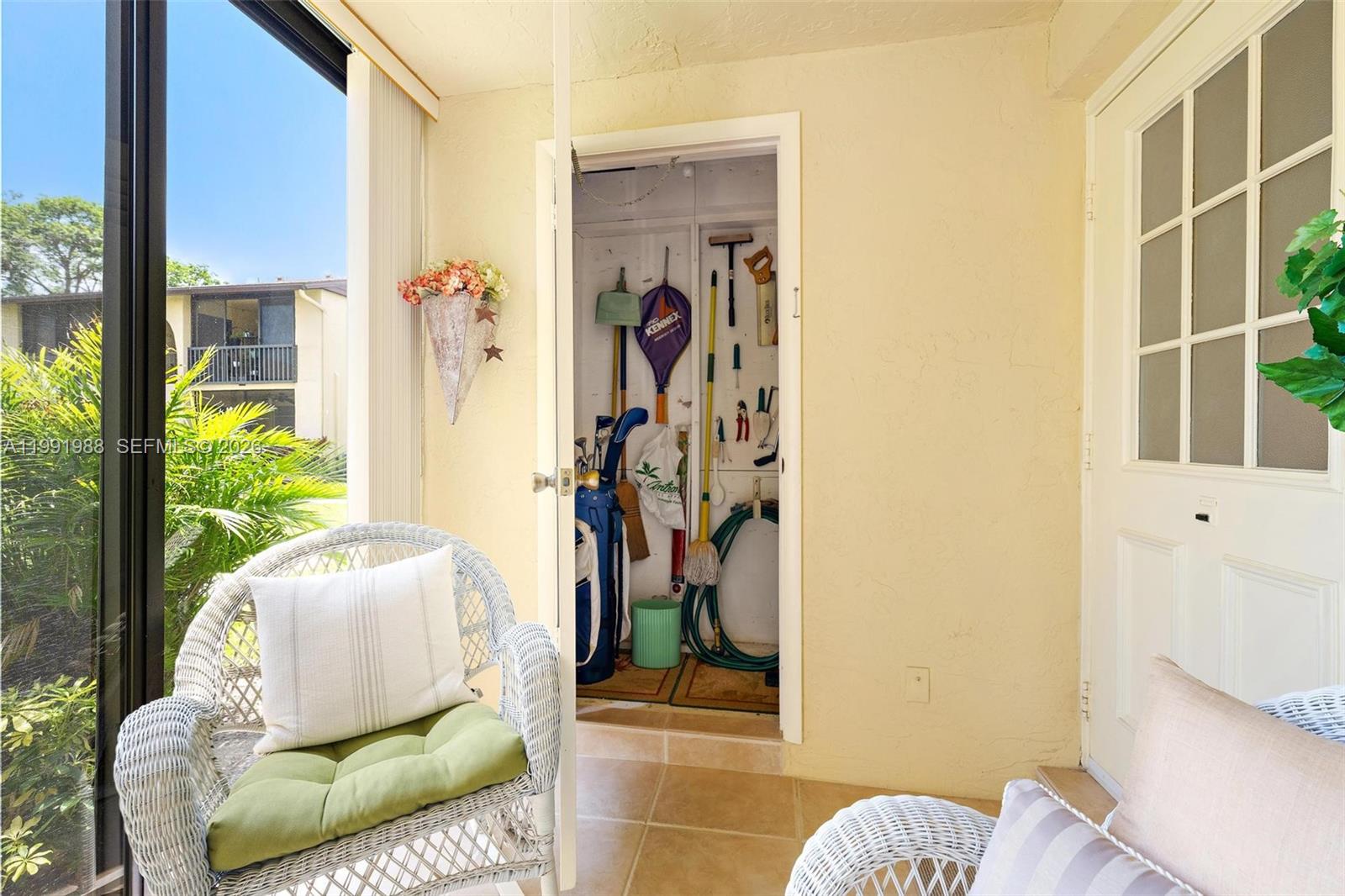 301 Pine Ridge Circle, Unit C1 Greenacres, FL 33463 - Photo 6 of 30 a living room with furniture and a window