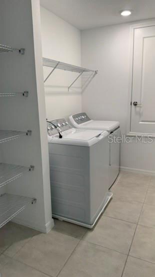 4520 Ranunculus Street Haines City, FL 33844 - Photo 16 of 19 a utility room with washer and dryer