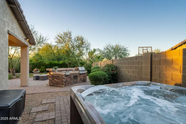 a view of a table and chairs in the patio