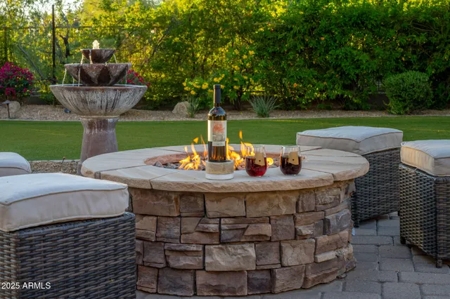 a view of backyard with outdoor seating and green space
