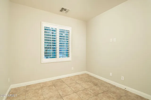 a bathroom with a sink a toilet and shower curtain