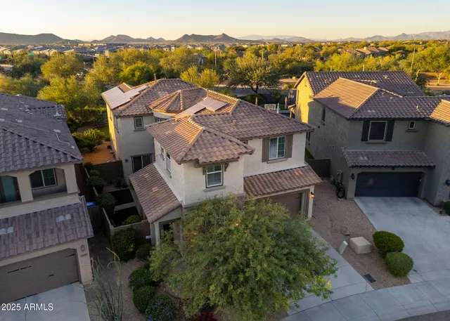 an aerial view of a house with a garden