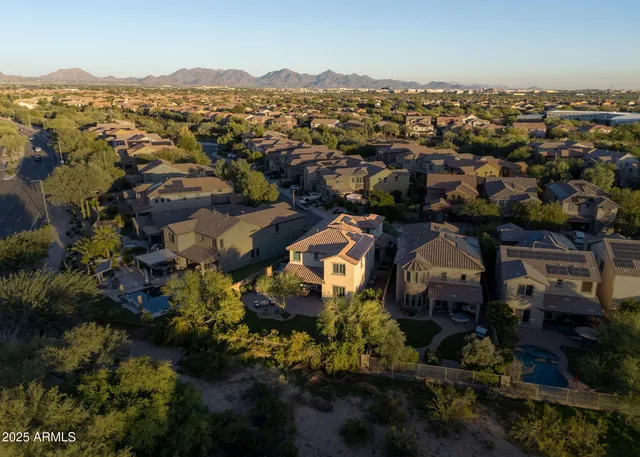 an aerial view of a house with a garden