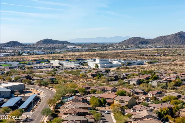 an aerial view of residential building and trees