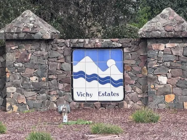 a brick building with a bench in front of it