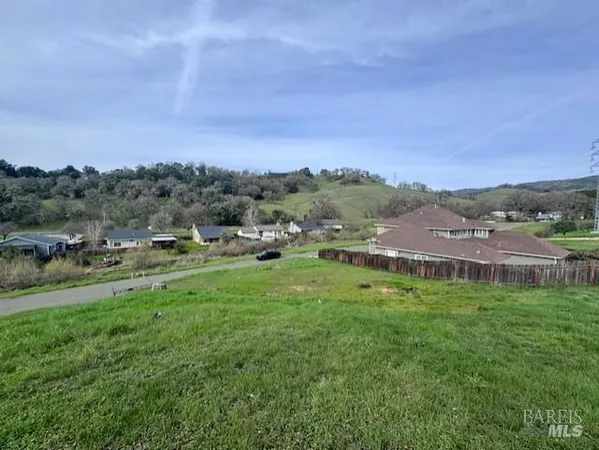 a view of a town with mountains in the background