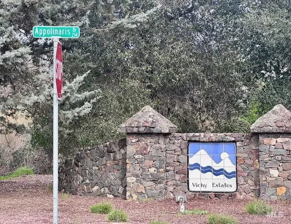 a sign board with a small yard