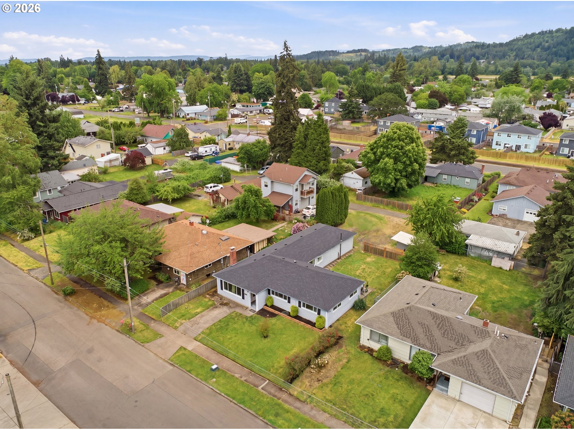 1357 Grove Street Lebanon, OR 97355 - Photo 34 of 37 an aerial view of a houses with a city view