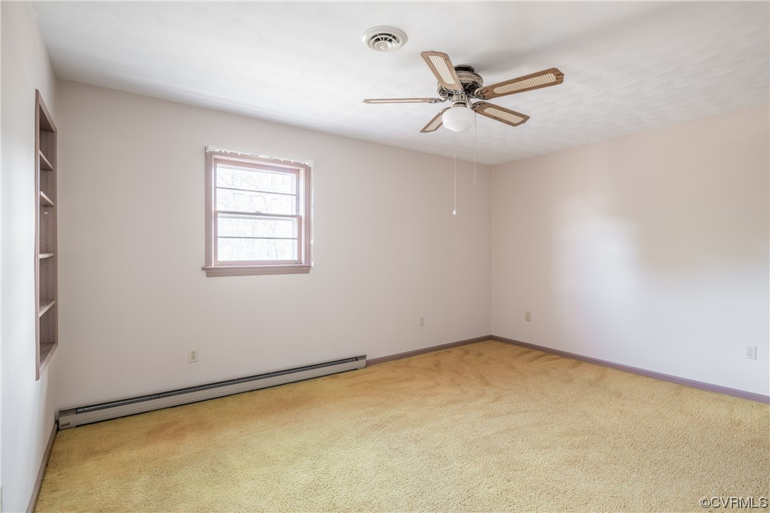 1976 Tuggle Road Farmville, VA 23901 - Photo 19 of 33 an empty room with closet and ceiling fan