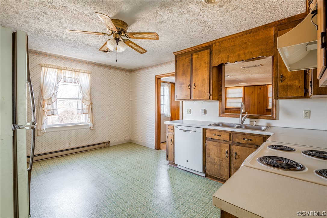 1976 Tuggle Road Farmville, VA 23901 - Photo 7 of 33 a kitchen that has a sink a stove and a microwave oven in it