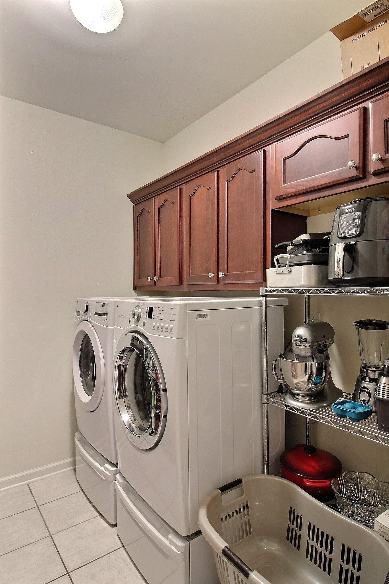 1156 Sunriver Cove Collierville, TN 38017 - Photo 14 of 37 a storage room with washer and dryer