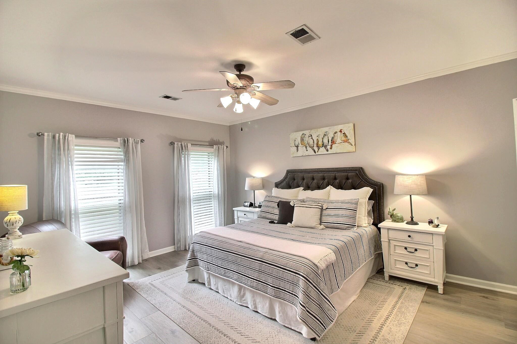 1156 Sunriver Cove Collierville, TN 38017 - Photo 15 of 37 a bedroom with a bed and wooden floor