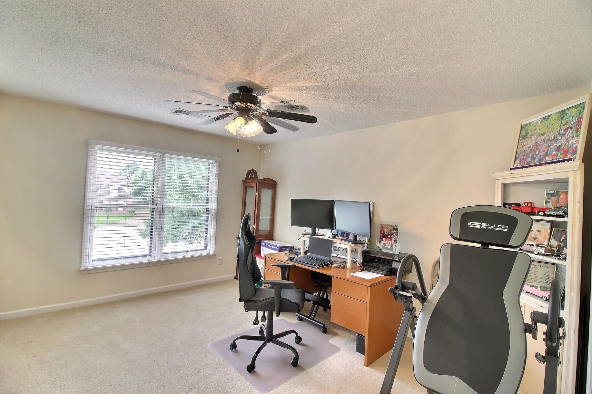 1156 Sunriver Cove Collierville, TN 38017 - Photo 18 of 37 a view of a workspace with furniture and a window