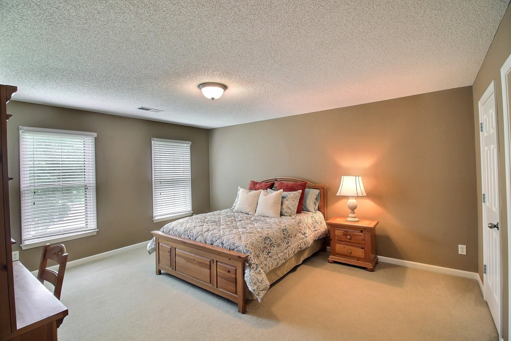 1156 Sunriver Cove Collierville, TN 38017 - Photo 21 of 37 a bedroom with a bed and window