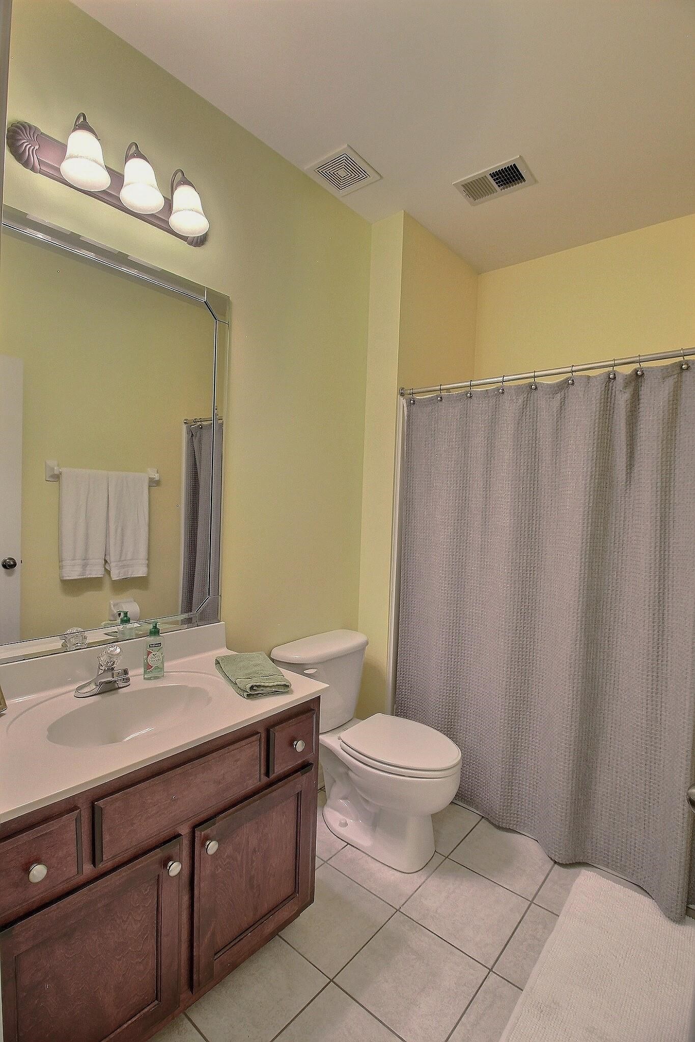 1156 Sunriver Cove Collierville, TN 38017 - Photo 28 of 37 a bathroom with a sink a toilet and a mirror