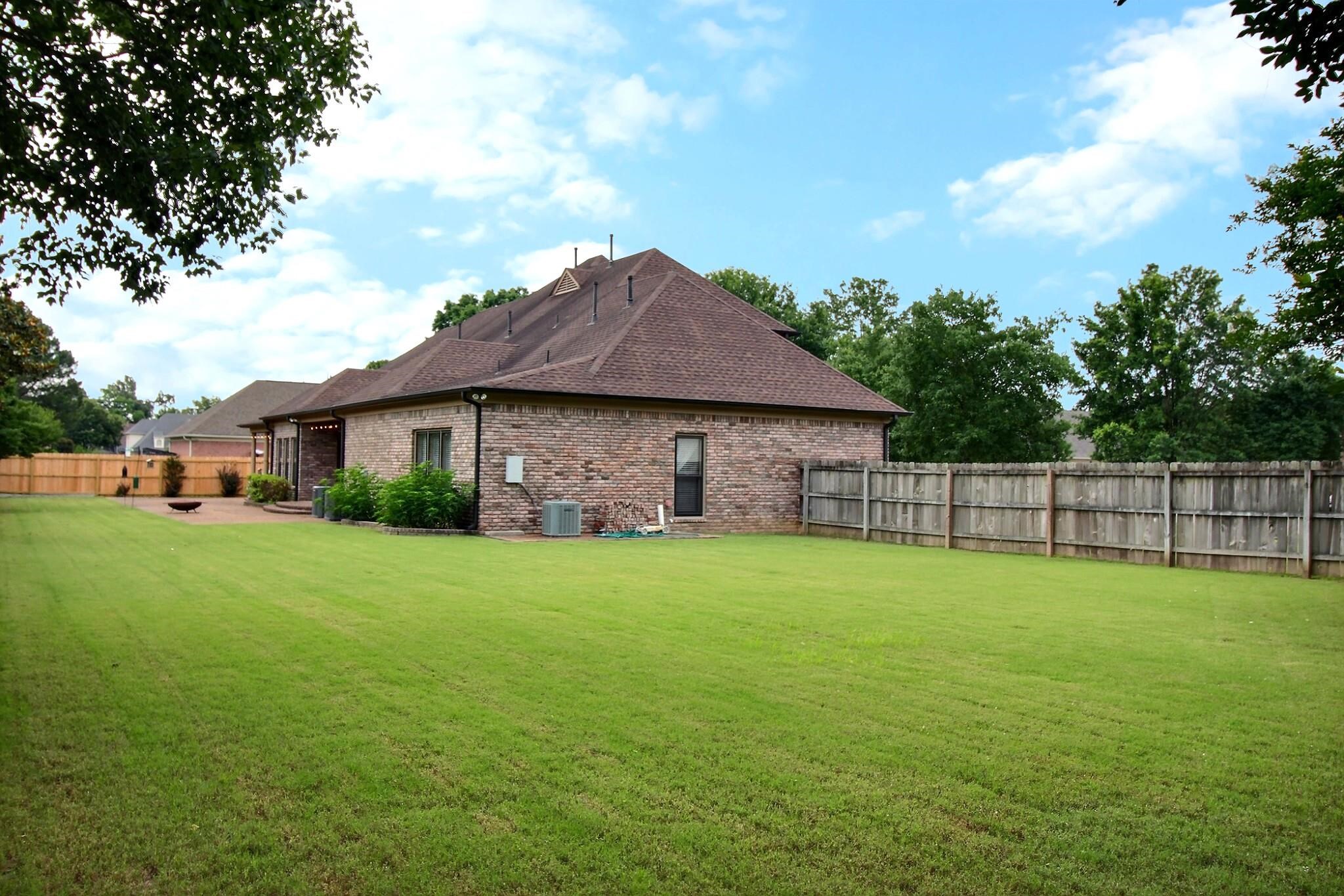 1156 Sunriver Cove Collierville, TN 38017 - Photo 35 of 37 a aerial view of a house next to a yard and deck