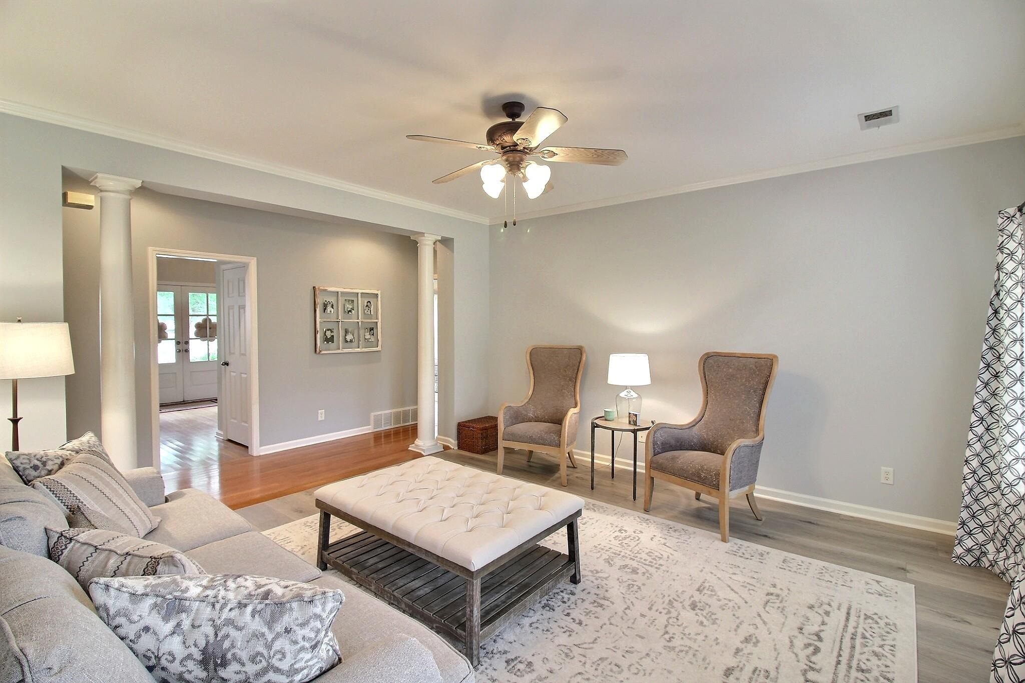 1156 Sunriver Cove Collierville, TN 38017 - Photo 8 of 37 a living room with furniture a window and a chandelier