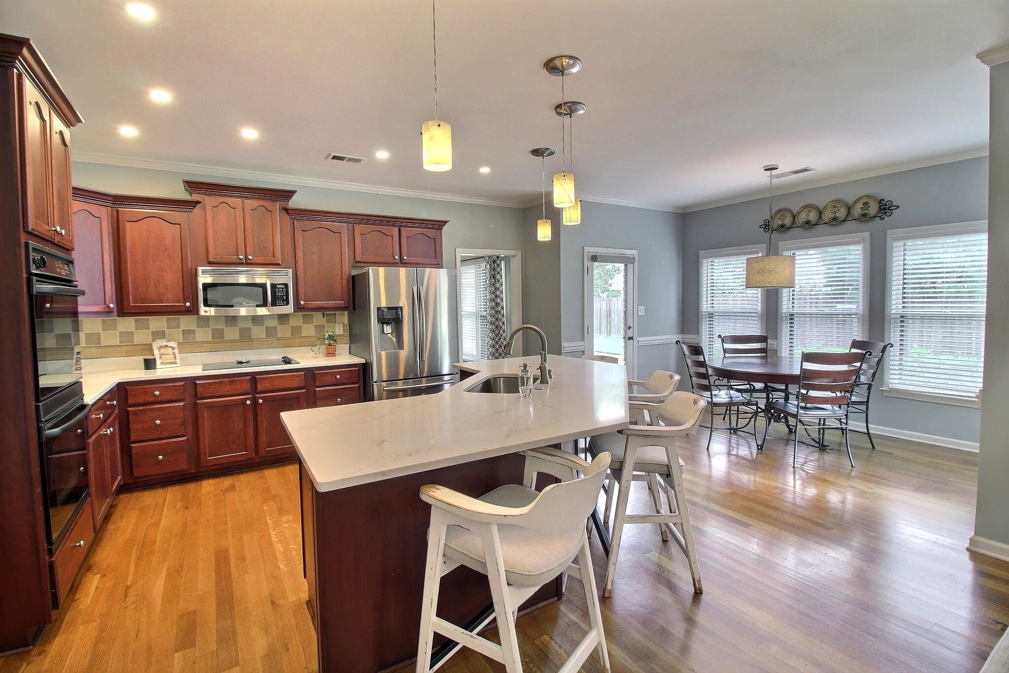 1156 Sunriver Cove Collierville, TN 38017 - Photo 9 of 37 a large kitchen with a table and chairs