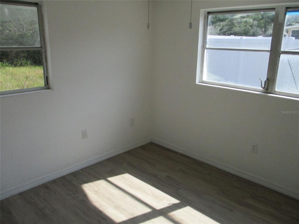 7925 Bracken Drive Port Richey, FL 34668 - Photo 11 of 11 an empty room with a window