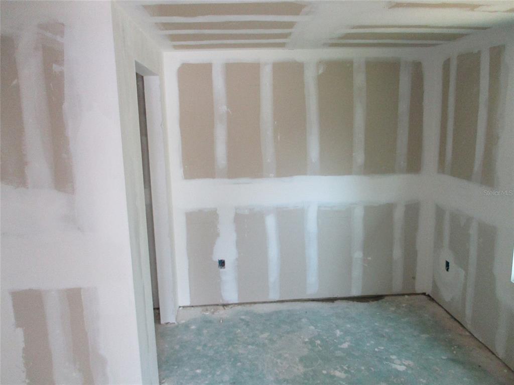 7925 Bracken Drive Port Richey, FL 34668 - Photo 5 of 11 a view of an empty room