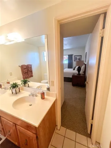 a bedroom with bed and window