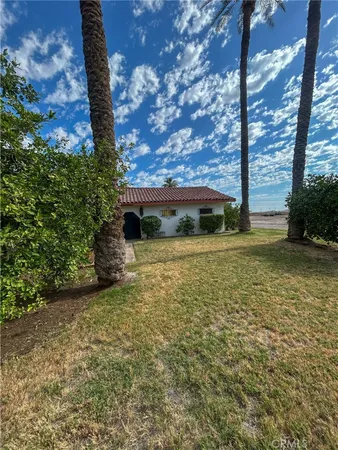 a view of a backyard of the house