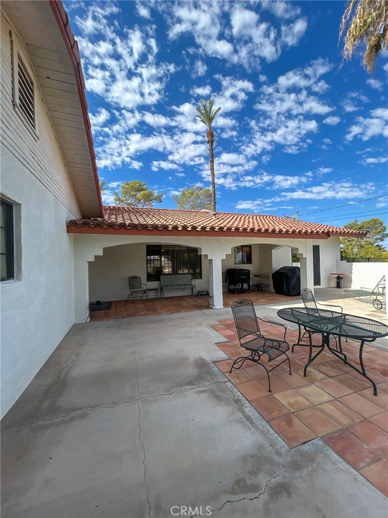 2153 Florence Boulevard Blythe, CA 92225 - Photo 25 of 38 a view of a patio with a table and chairs