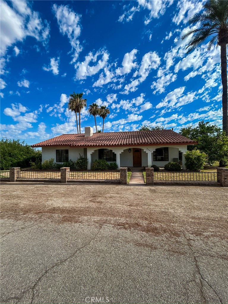 2153 Florence Boulevard Blythe, CA 92225 - Photo 4 of 38 a front view of a house with a yard