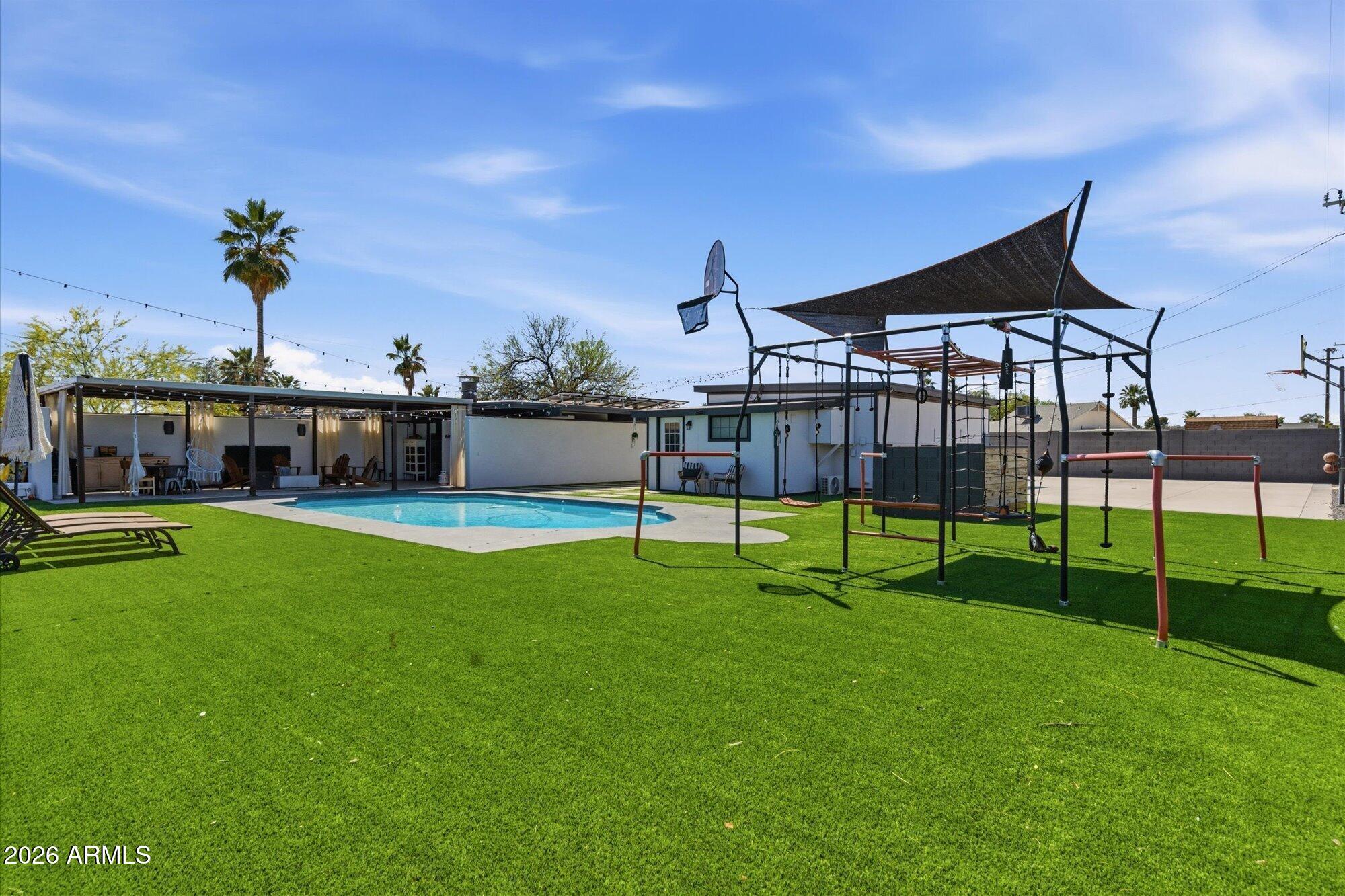 3020 East Wethersfield Road Phoenix, AZ 85032 - Photo 25 of 46 a view of house with a big yard