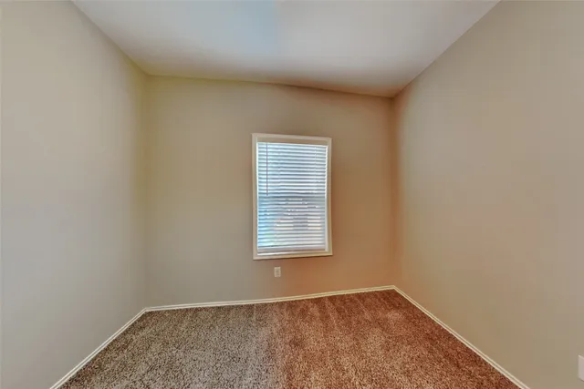 a bathroom with a toilet sink and shower