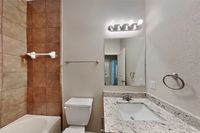 a backyard of a house with yard and garage