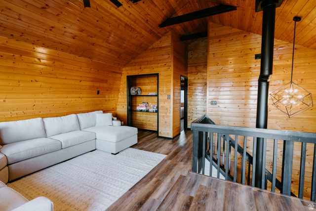 1413 Basel Drive Midway, UT 84049 - Photo 74 of 137 Living room featuring wooden walls, a wooden ceiling with exposed beams, and wood finished floors