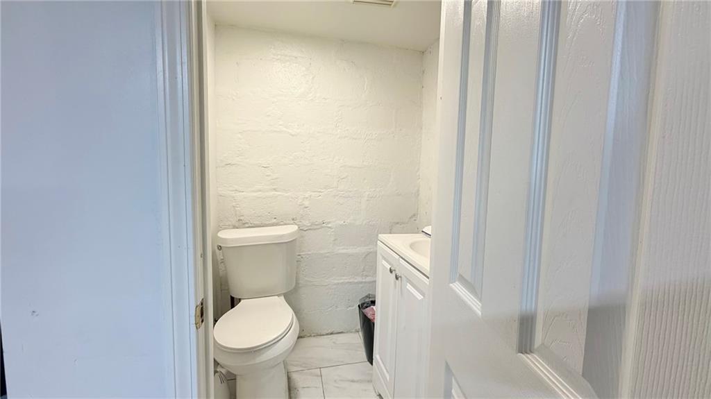 3303 Niagara Street Pittsburgh, PA 15213 - Photo 13 of 17 a white toilet sitting next to a shower