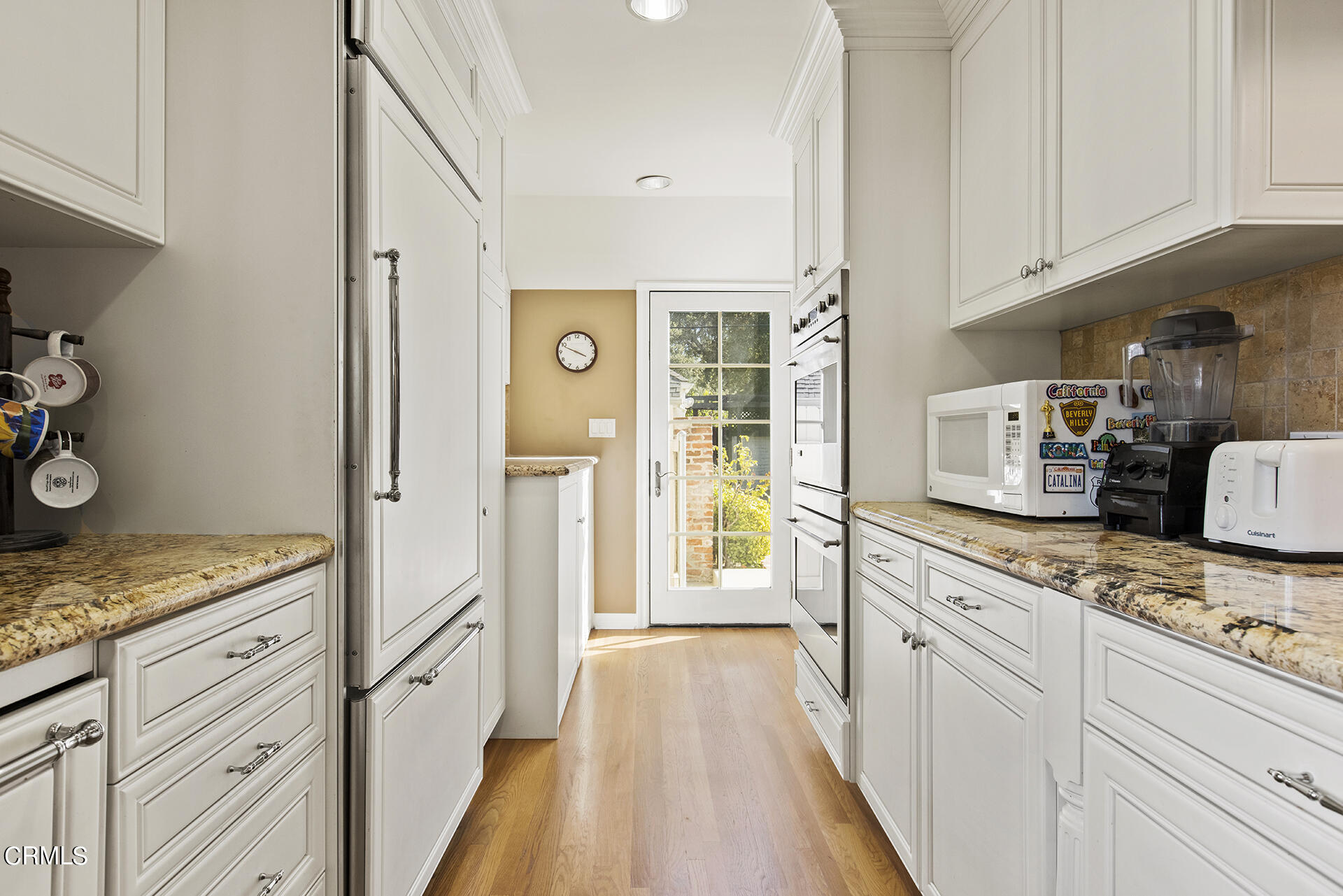 3320 Yorkshire Road Pasadena, CA 91107 - Photo 12 of 26 a kitchen with granite countertop cabinets a sink a stove and a refrigerator