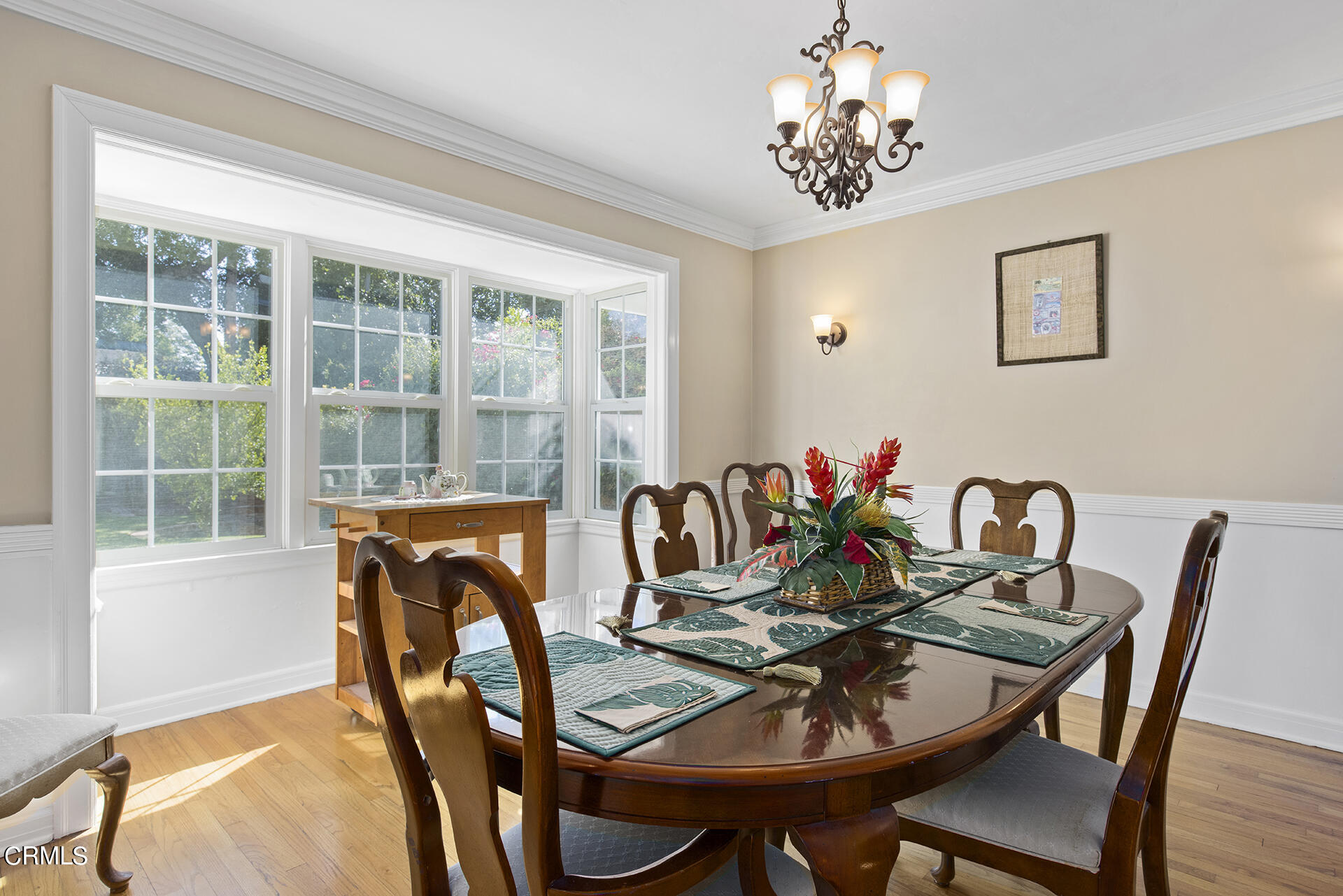 3320 Yorkshire Road Pasadena, CA 91107 - Photo 8 of 26 a dining room with furniture a potted plant and a chandelier