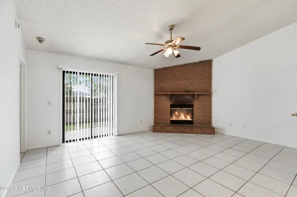 a kitchen with a white cabinets and refrigerator