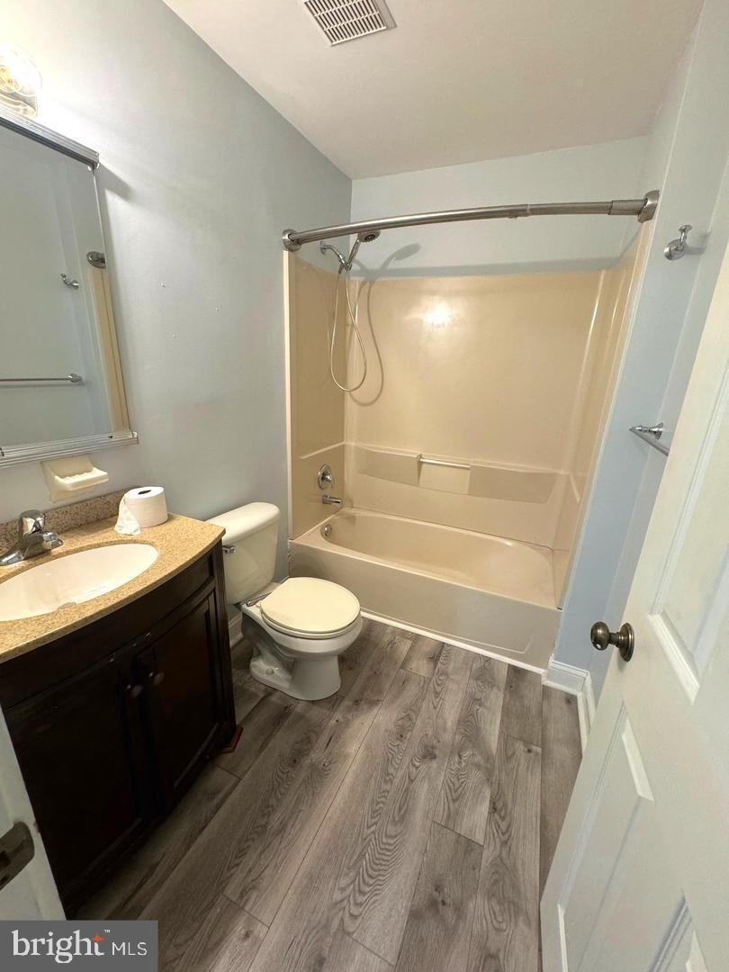 7 Hamlet Court, Unit B Sicklerville, NJ 08081 - Photo 10 of 15 a bathroom with a sink a toilet and shower