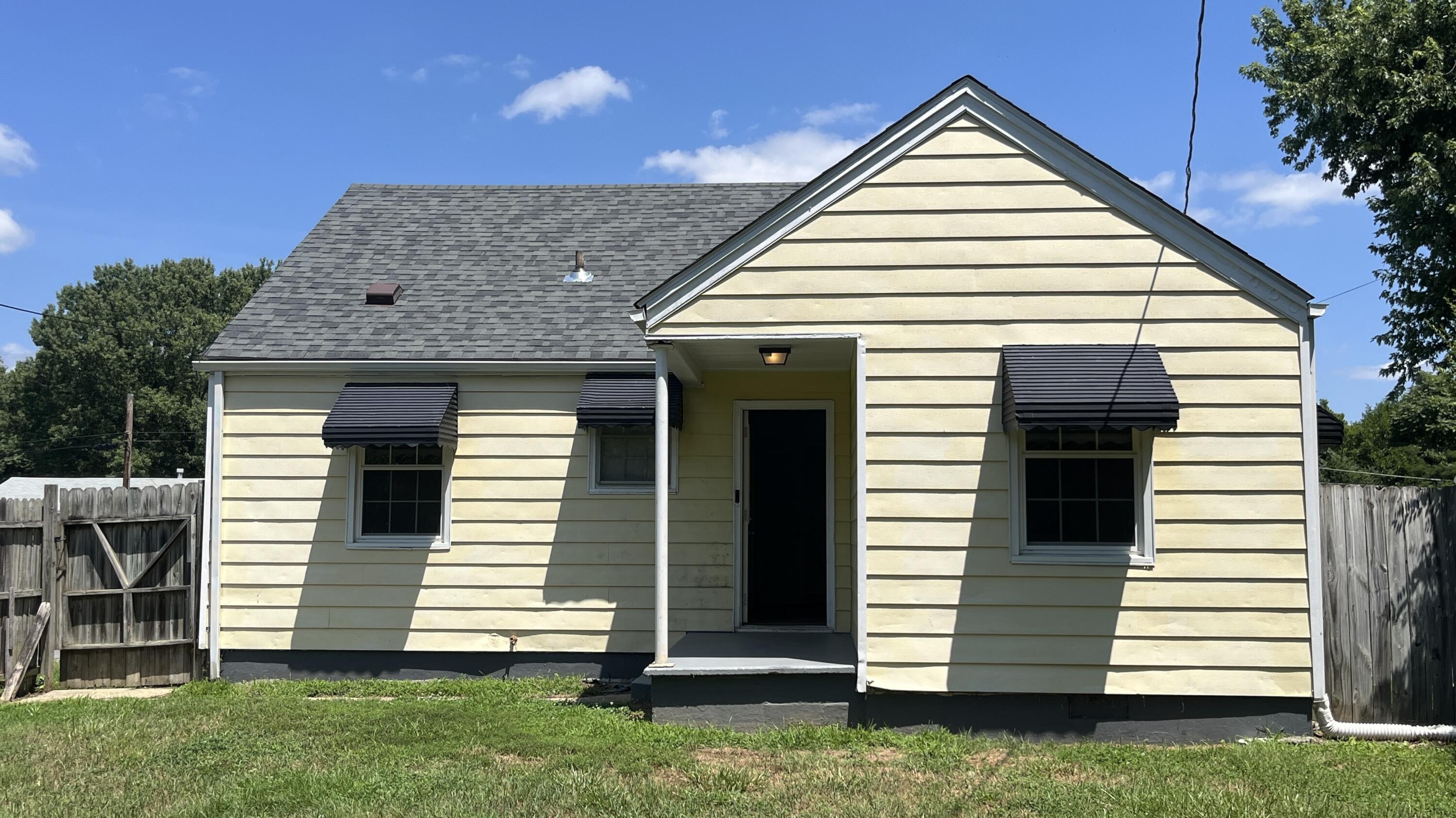 4042 Tennessee Avenue Northwest Roanoke, VA 24017 - Photo 17 of 17 a front view of a house with a yard