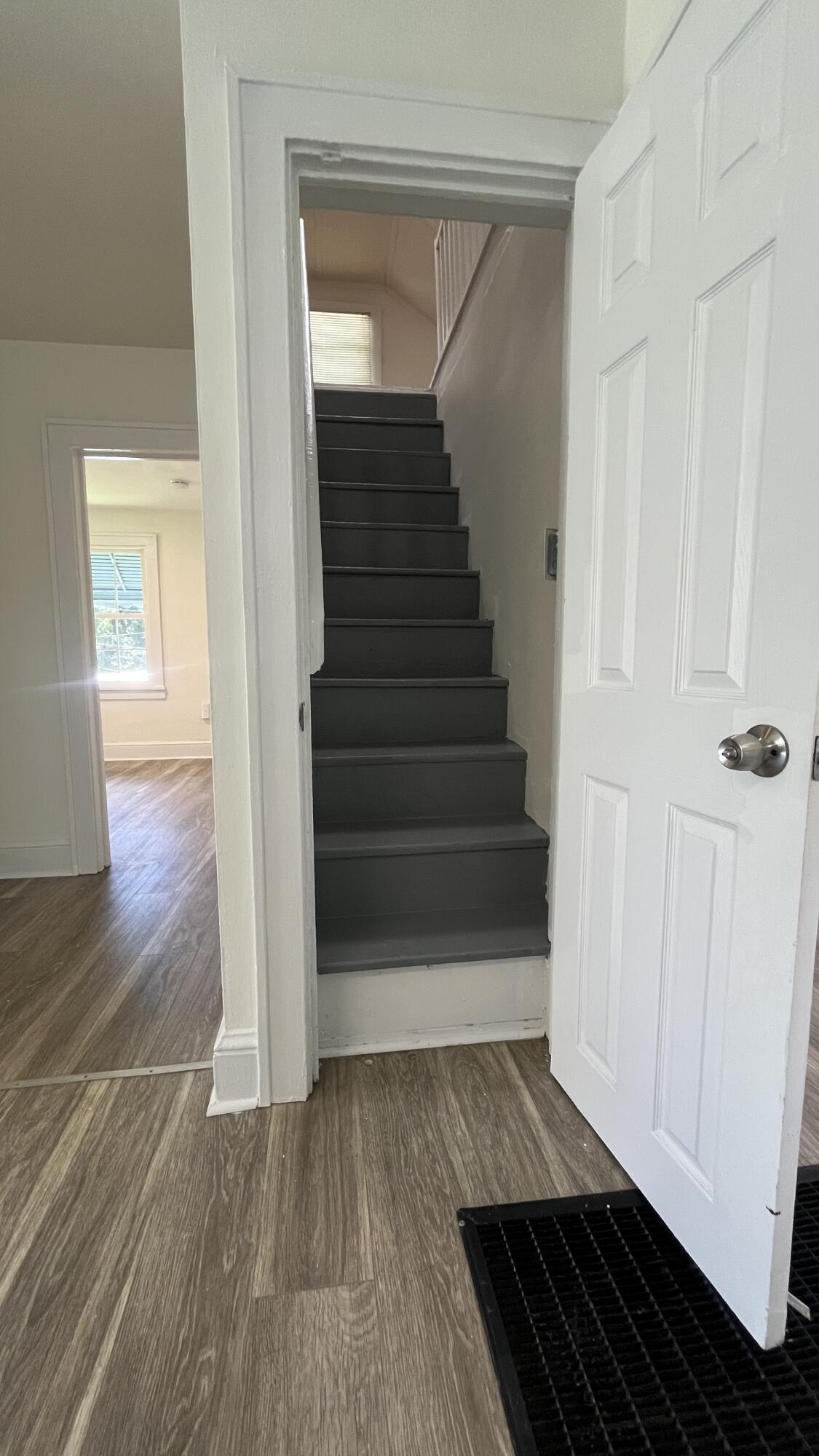 4042 Tennessee Avenue Northwest Roanoke, VA 24017 - Photo 7 of 17 a view of a hallway view with wooden floor and staircase