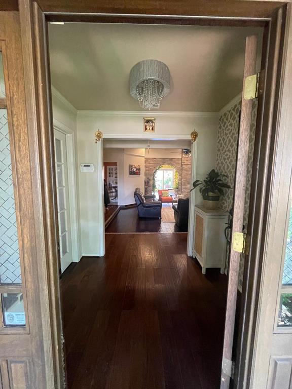 3612 Cross Bend Road Plano, TX 75023 - Photo 14 of 38 Hallway with ornamental molding and dark wood-type flooring