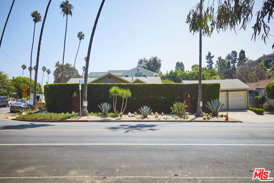 803 Wellesley Avenue Los Angeles, CA 90049 - Photo 1 of 1 a ocean view with palm trees