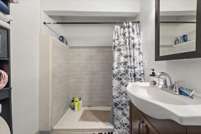 a kitchen with stainless steel appliances granite countertop a refrigerator and a stove