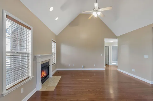 wooden floor in an empty room with a fireplace