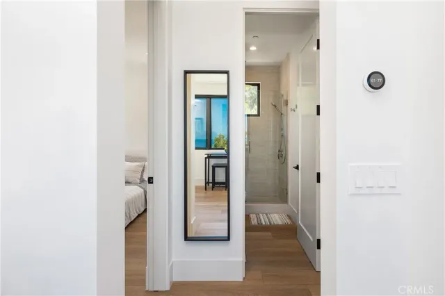 a view of a bathroom from a hallway