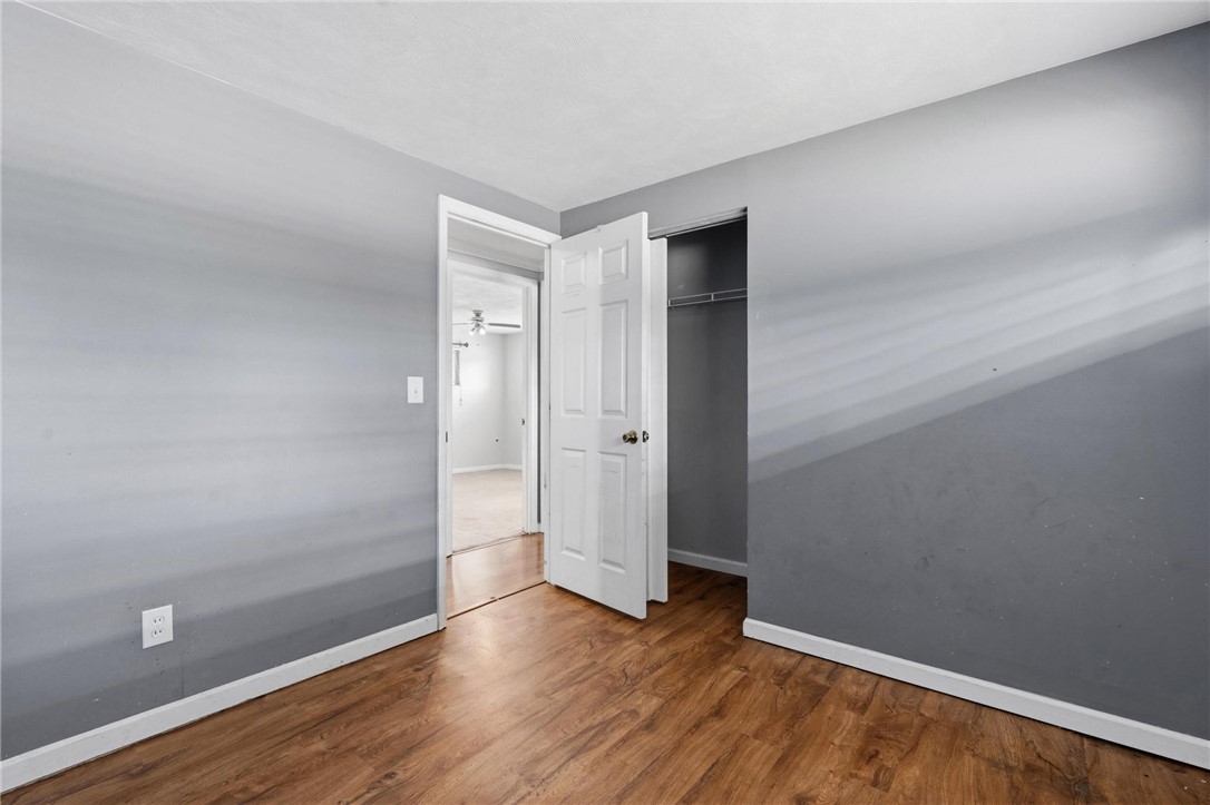 3890 Endover Road Dayton, OH 45439 - Photo 21 of 26 This spacious bedroom features warm wood flooring and a convenient closet.